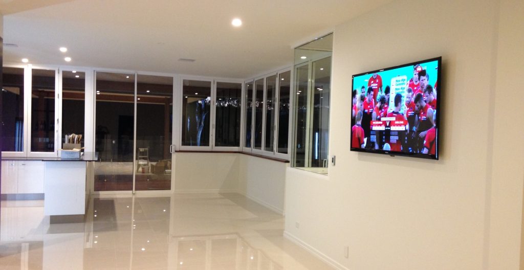 flush tv hung in lounge wall mounting